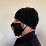 Side view of Black Cotton Face Mask with silk embroidered Crusader Shield, adjustable straps and pocket for disposable filter