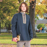 lightweight cotton folk shirt has button neck with embroidered trim around collar and placket and matching trim at cuffs and hem