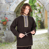 lightweight cotton folk shirt has button neck with embroidered trim around collar and placket and matching trim at cuffs and hem